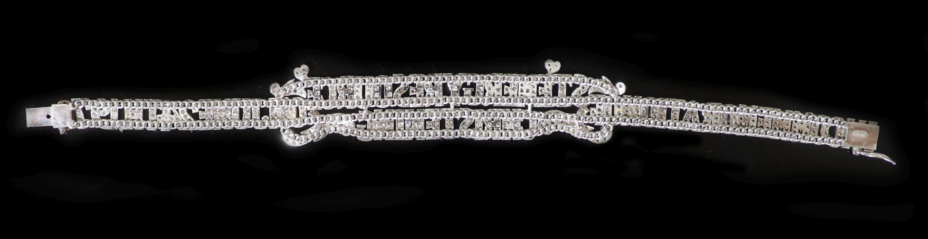 A 585 white gold and diamond bracelet with 1970 presentation inscription
